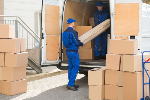Professional removals in Westgreen with moving van and packed boxes