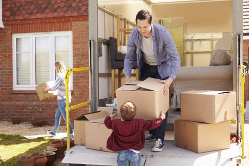 Moving and storage service concept in Westgreen with packed boxes and furniture