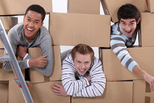 Apartment moving team handling furniture during flat removals in Westgreen