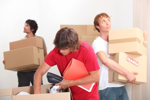 Professional movers handling furniture during a Westgreen house move