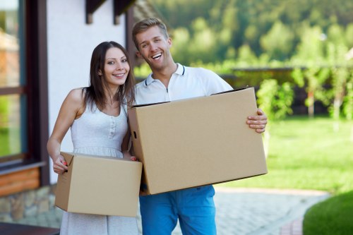 Movers protecting furniture and fragile items in a Westgreen flat relocation