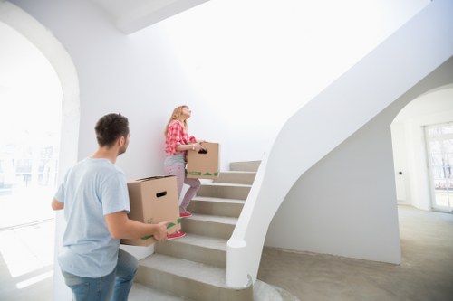 Packed boxes and furniture ready for transport by a Westgreen man and van