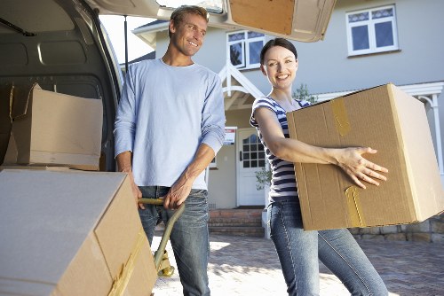 Packed moving boxes and furniture ready for transport during a Westgreen relocation